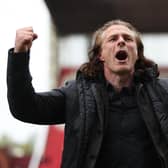 STOKE ON TRENT, ENGLAND - APRIL 29: Gareth Ainsworth manager of Queens Park Rangers celebrates following the Sky Bet Championship between Stoke City and Queens Park Rangers at Bet365 Stadium on April 29, 2023 in Stoke on Trent, England. (Photo by Nathan Stirk/Getty Images)