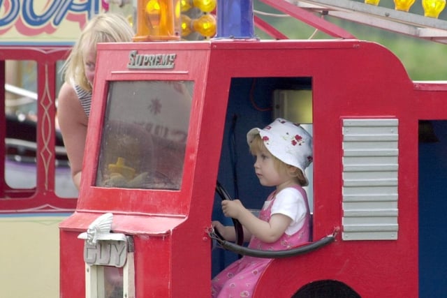 Two-year-old Molly Groake from Great Eccleston keeps her eyes on the road at the funfair at St Michael's vintage rally
