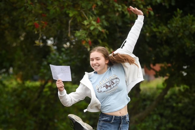 Maria Pechkareva jumps for joy after receiving her results.