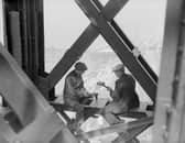 Two men working on a girder in Blackpool Tower in 1933. They seem as comfortable as if they were sat at a desk!