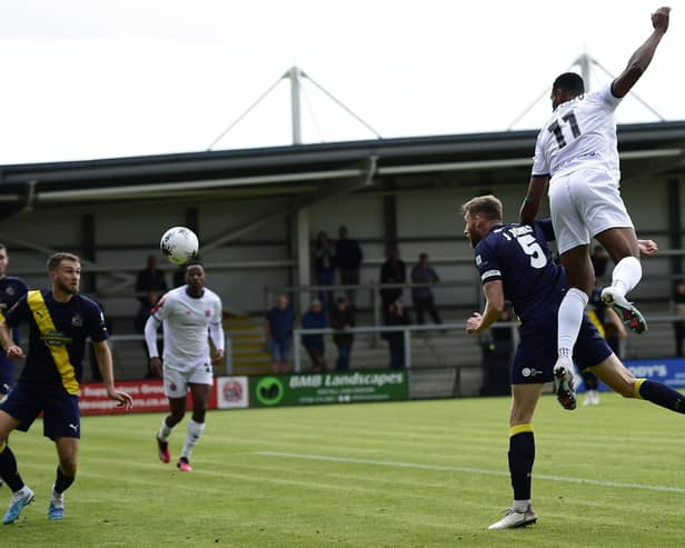 AFC Fylde's Gold Omotayo scores their second goal against Altrincham on Monday Picture: Steve McLellan