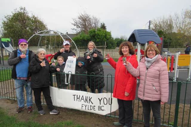Friends of Blackpool Road North Playing Fields Jol Martyn -Clark (treasurer), Di Martyn-Clark (secretary ),  Coun Karen Henshaw (vice-chairman) and Coun Joanne Gardner (assistant treasurer) met a local family (pictured centre) enjoying the new Blackpool Road North Playing Fields play area - and raised a toast together