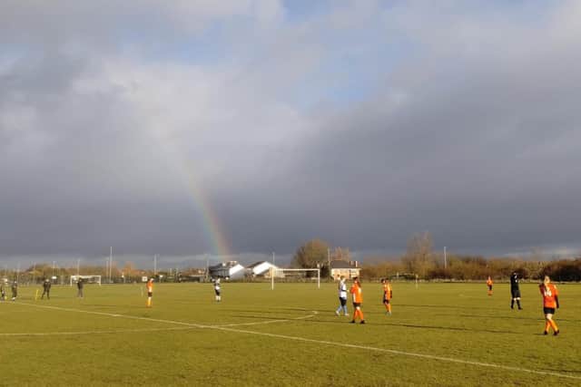A Rainbow over the Players on Sunday Morning. Photo: Duncan Barnes