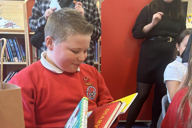 One of the pupils at Our Lady of the Assumption enjoys looking at Jeff Kinney's Diary of a Wimpey Kid.
