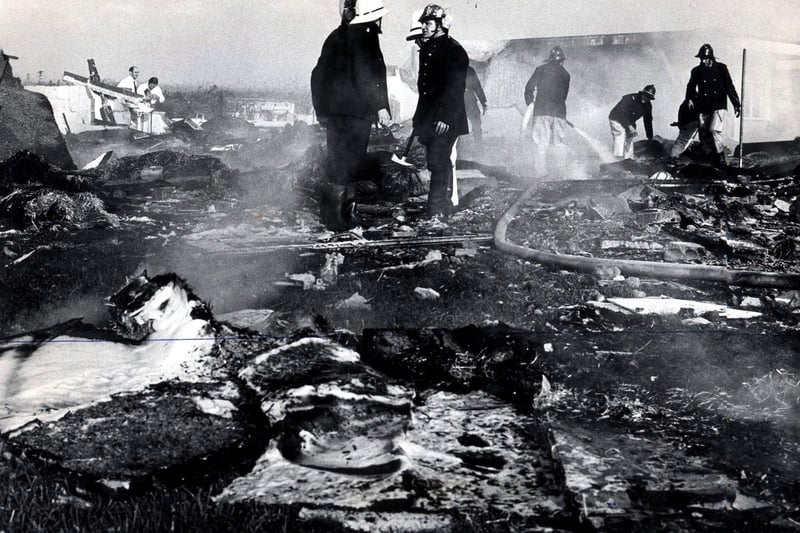 Firemen search among the smoking wreckage of Pontins Air Crash in 1972