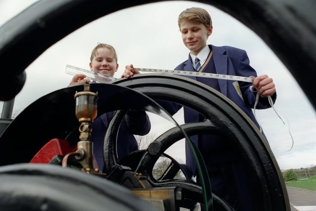 Sam Taylor and Nicky Hoyland, who were both 12, taking measurements on an oil engine - which was at the school as part of Science, Engineering and Technology week in 1997