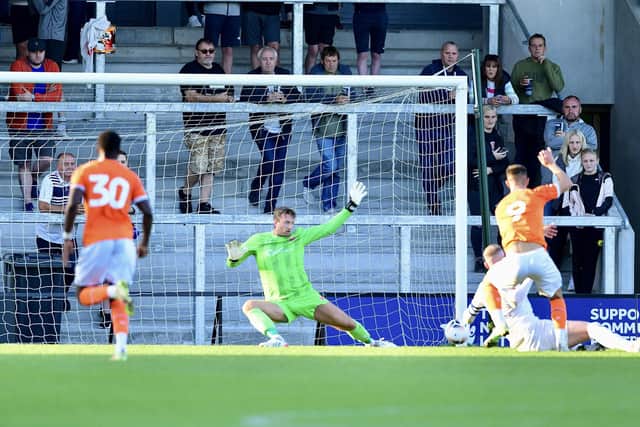 Jerry Yates slots home Blackpool's opener on the stroke of half time