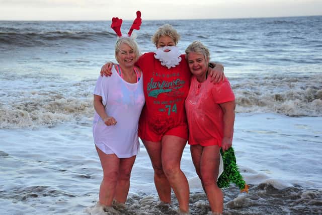 From left, Cathy Broad, Caroline James and Janet Moss take part in the Fleetwood New Year Day Dip in a previous year