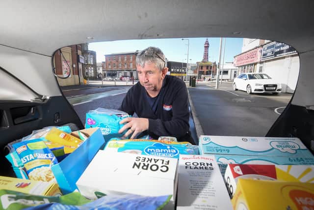 George Robinson from C Cabs with some of the items donated to help refugees due to the crisis in Ukraine