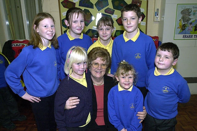 The Headteacher of Christ the King RC Primary School, Josephine Fleming, says goodbye to pupils on her retirement. The pupils, from left, Danielle Grundy, caroline Parkes, Candice Tugwell, Richard and Dominic Smith with Danielle Roney (left) and Eve Kennerley at the front in 2000