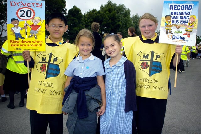 Hundreds of pupils from Waterloo and Mereside Primary Schools in Blackpool took part in a record-breaking 'walking bus' event, held in Asda's car park - Gary Tang, Amy-Jo Heyworth, Megan Ward and Megan Todd, 2004