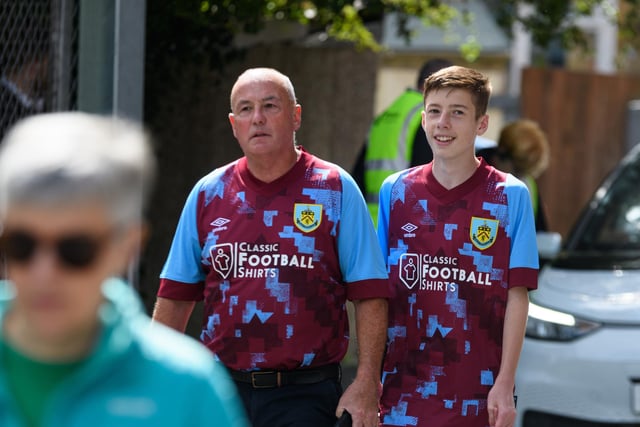 Burnley fans arrive at Turf Moor ahead of the Lancashire Derby with Blackpool. Photo: Kelvin Stuttard