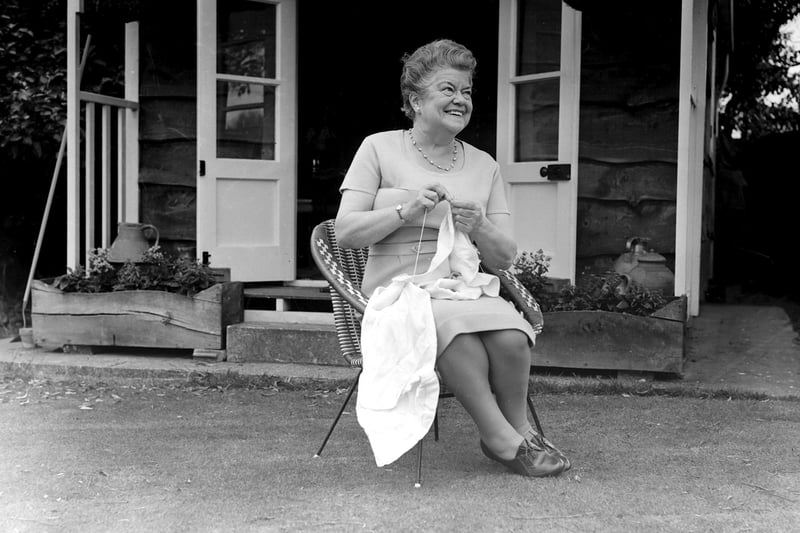 Violet Carson relaxing with some knitting in the garden of her Fleetwood Road , Bispham home in 1965