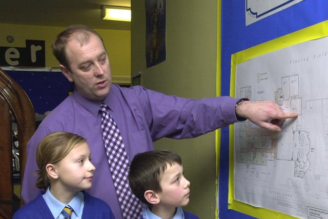 Andy Mellor, headmaster of St Nicholas CE Primary school, Marton shows some of his pupils the plans for extensions in 2004