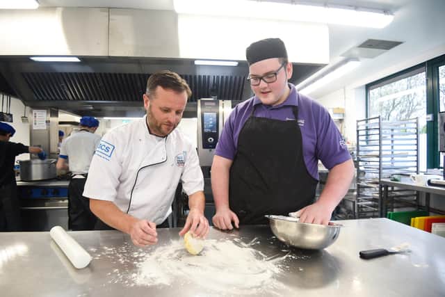 Students at the Chefs Academy at Highfield Day Centre. Pictured is development chef Lee Connor with student Vaughan Davenport.