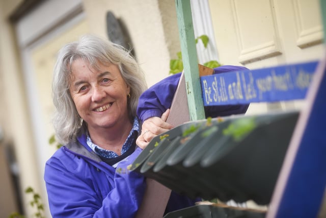 A group of residents have created a community garden in their alleyway called Strawberry Gardens. Pictured is Julie Brierley.