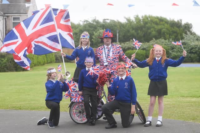 Pupils at Gateway Academy celebrate the Queen's Jubilee. Year 3 teacher Mr Barnaby with some of the pupils.