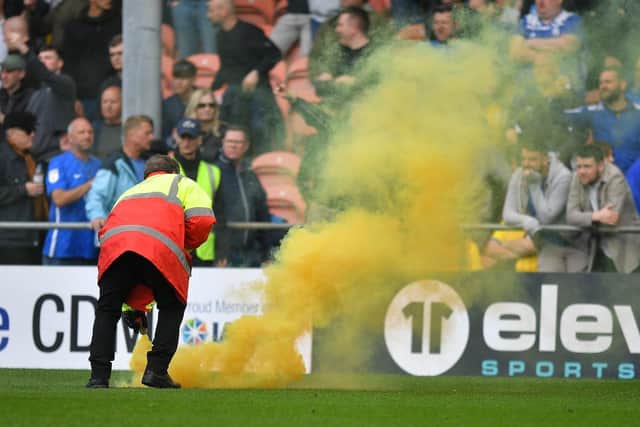 This was just one of several smoke bombs thrown onto the pitch as Birmingham fans struggled to contain their anger