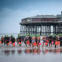 Brave souls taking the plunge at the Blackpool pier to pier swim in 2019. This year's event has had to be cancelled at the last minute for safety reasons
