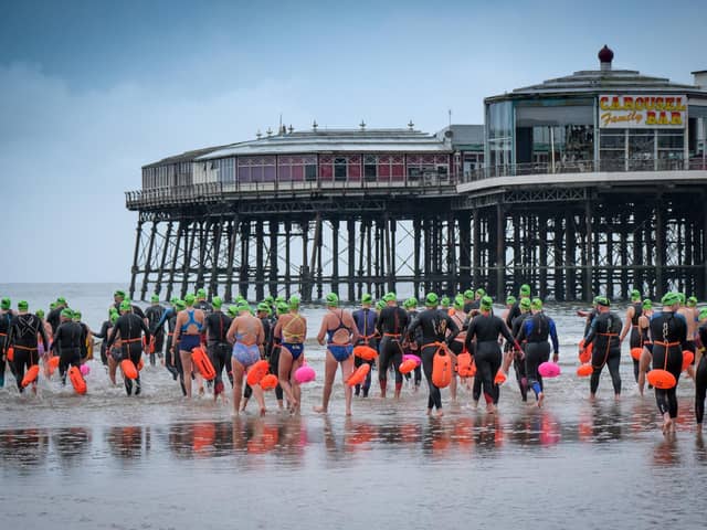 Brave souls taking the plunge at the Blackpool pier to pier swim in 2019. This year's event has had to be cancelled at the last minute for safety reasons