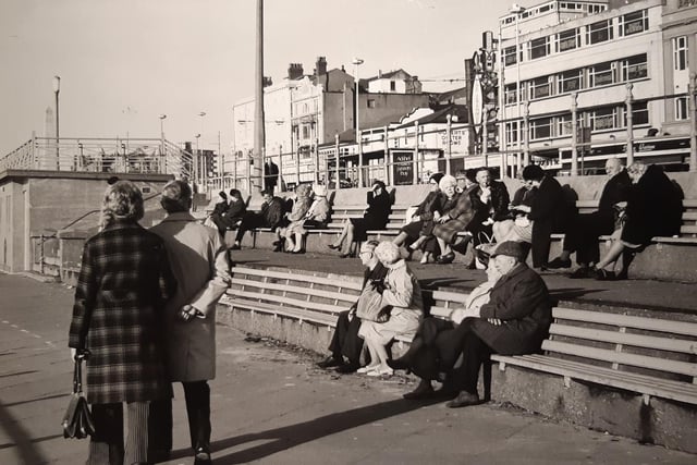 This was a warm day in March and people were taking advantage of the early sunshine on the benches which overlooked the sea. Roberts Oyster Rooms can be seen in the distance