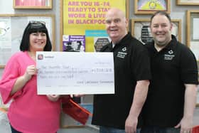 Shaun presents the cheque to Kim Hughes supported by Ben Gorry