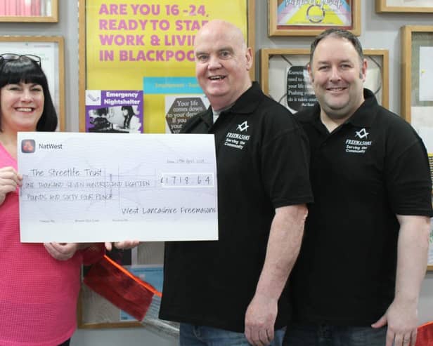 Shaun presents the cheque to Kim Hughes supported by Ben Gorry