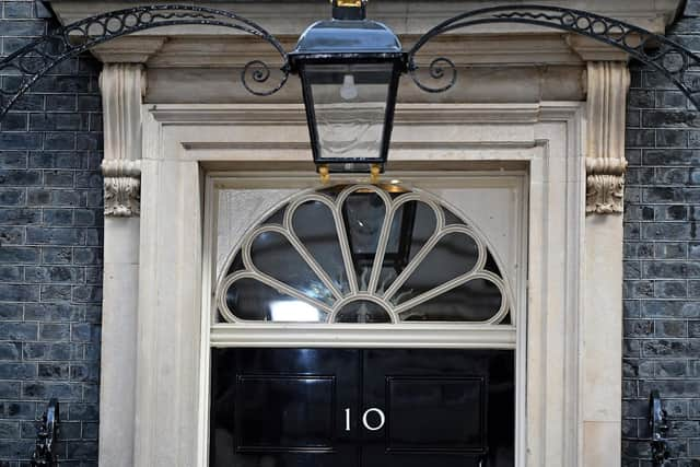 The door to 10 Downing Street, the official residence of Britain's Prime Minister, is pictured in central London on October 24, 2022. - British Conservative Rishi Sunak was on Monday poised to become prime minister and the country's first leader of colour, after a dramatic decision by Boris Johnson to abandon an audacious political comeback. (Photo by JUSTIN TALLIS / AFP) (Photo by JUSTIN TALLIS/AFP via Getty Images)