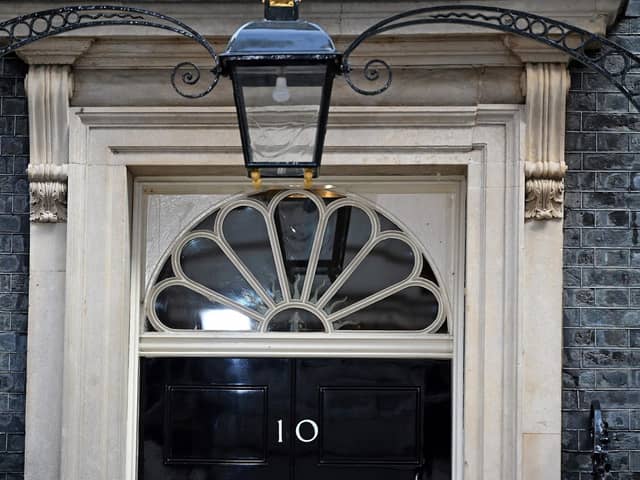 The door to 10 Downing Street, the official residence of Britain's Prime Minister, is pictured in central London on October 24, 2022. - British Conservative Rishi Sunak was on Monday poised to become prime minister and the country's first leader of colour, after a dramatic decision by Boris Johnson to abandon an audacious political comeback. (Photo by JUSTIN TALLIS / AFP) (Photo by JUSTIN TALLIS/AFP via Getty Images)