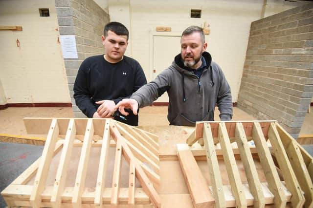 Unique Training Group are giving youngsters classes in construction. Pictured is Koben Threlfall with David Hodge, director of Unique Training Group.