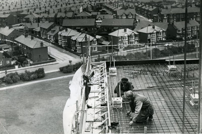 Men working on the new high rise flats at Queenstown, Layton, Blackpool , in 1963 Cumbrian Avenue joins Mather Street which runs left to right across the centre. The spire of Layton Hill Convent School (now St Mary's High school  )can be seen in the distance to the left. The open ground of Kingscote playing fields can be seen top right. This was 1963