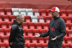 Neil Critchley with Jurgen Klopp (Photo by John Powell/Liverpool FC via Getty Images)