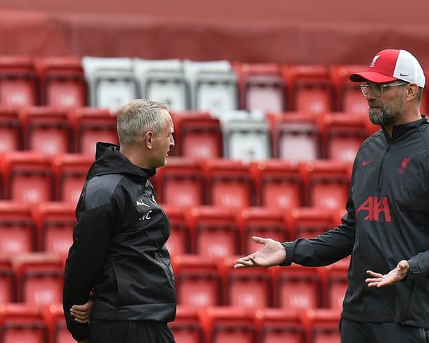 Neil Critchley with Jurgen Klopp (Photo by John Powell/Liverpool FC via Getty Images)