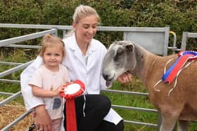 Felicity Mason and her daughter Mia, two with their winning Blue Faced Leicester Photo: Neil Cross