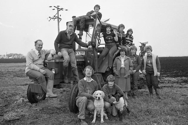 Members of Winmarleigh Young Farmers' Club who took part in a 30 hour non-stop ploughing marathon attempt to raise £1,000 for a guide dog. In front are trainee guide dog Quince and the club's pet lamb Joe
