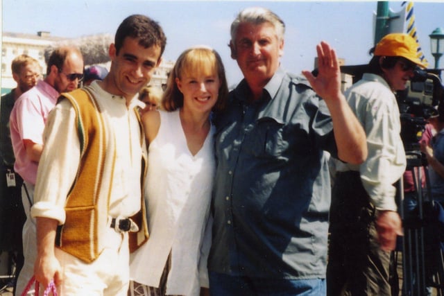 Coronation Street stars Kevin and Sally with local photographer Robert McDougall during filming on North Pier Blackpool in 1994