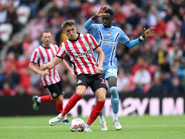 SUNDERLAND, ENGLAND - JULY 31: Sunderland player Dan Neil is challenged by Coventry player Fabio Tavares during the Sky Bet Championship between Sunderland and Coventry City at Stadium of Light on July 31, 2022 in Sunderland, England. (Photo by Stu Forster/Getty Images)