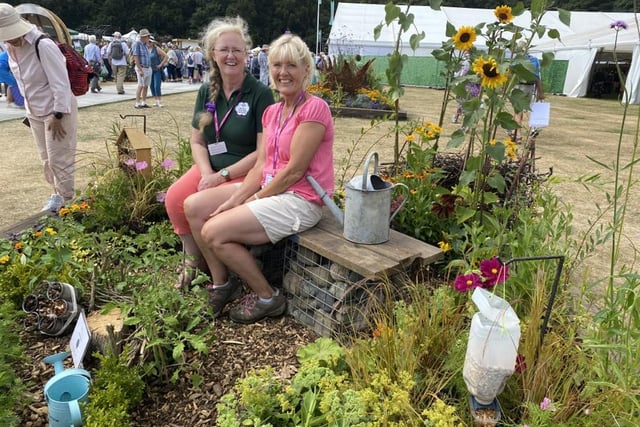 Sharon Martin (left) and Martine Hayhurst of Elswick in Bloom pictured at their Greener Border mini garden entitled 'We Can Do It!' which won a silver medal   Photo:Fiona Finch