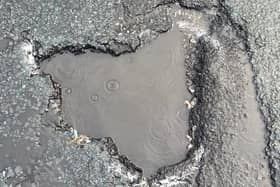 The pothole that County Cllr John Fillis was told had been filled in after he reported it - but which was still blighting the road days later