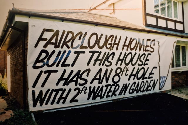 Clive Welch's boarded up home with a sign which made his feelings very clear