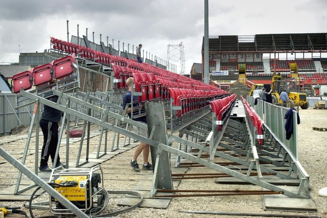 The new temporary seating for the East Stand at Bloomfield Road being assembled as the old South Stand comes down