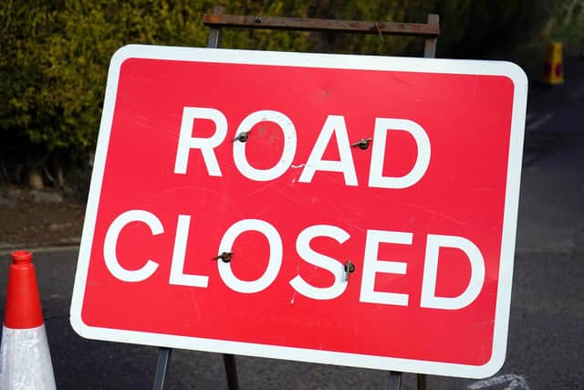 Road closed sign.