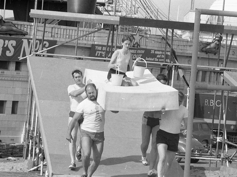 Competitors taking part in It's a Knockout at Blackpool's open air baths