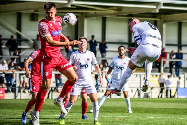 AFC Fylde's Alex Whitmore gets in a header during their defeat to Scarborough Athletic Picture: Steve McLellan