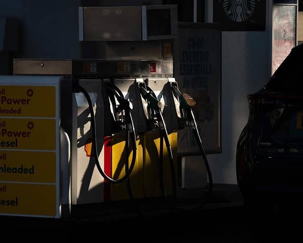 A customer arrives to re-fuel his car at a petrol station as fuel prices dip slightly in NI (photo by Bryn Colton/Getty Images)