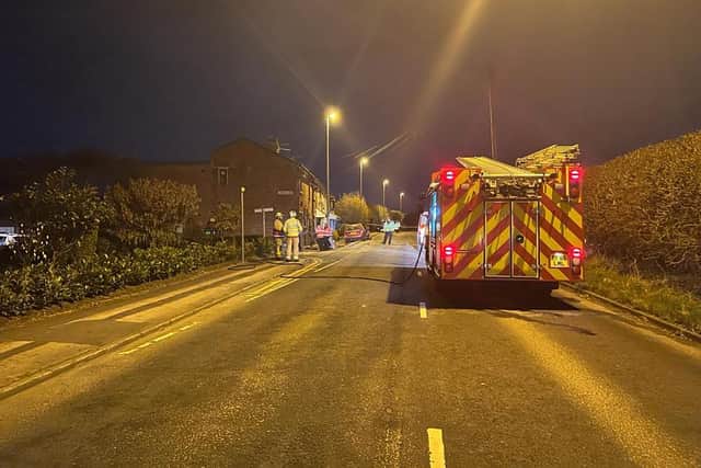 Fire crews were called to the scene after the car reportedly struck a gas mains, causing homes to be evacuated
