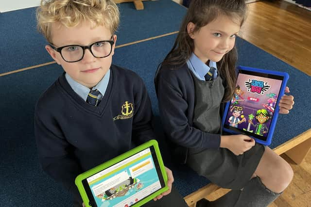 Robert Rhodes and Imogen Leach with the new iPads.