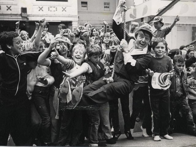Magician Paul Daniels gets into the swing of things after opening Professor Peabody's Play Place in the Winter Gardens, 1983