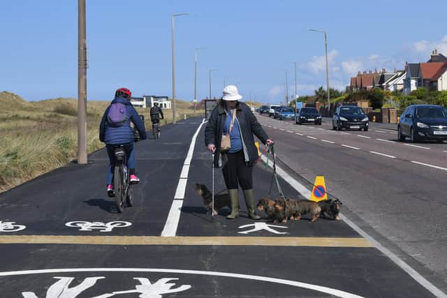 The face pedestrians are between the cycle path and the road has caused some controversy