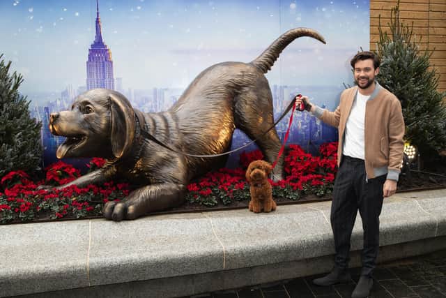 Jack Whitehall photographed with a giant sculpture to celebrate the release of "Clifford The Big Red Dog" at Leicester Square in Decemeber 2021.
